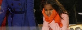 Sasha Obama, younger daughter of U.S. President Barack Obama, watches inaugural parade in Washington