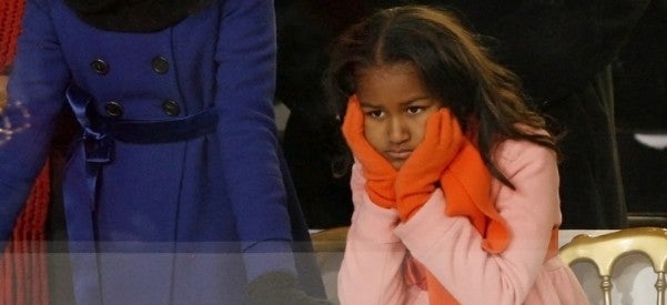 Sasha Obama, younger daughter of U.S. President Barack Obama, watches inaugural parade in Washington