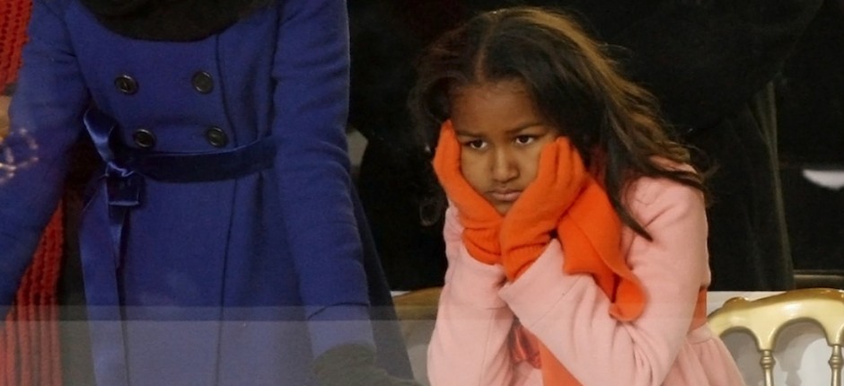 Sasha Obama, younger daughter of U.S. President Barack Obama, watches inaugural parade in Washington