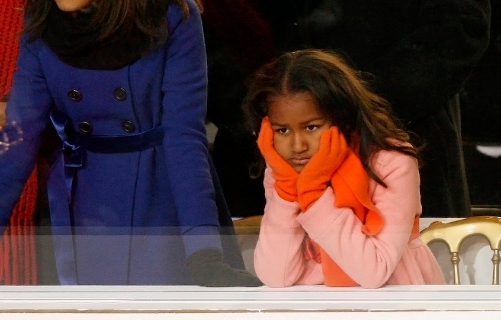 Sasha Obama, younger daughter of U.S. President Barack Obama, watches inaugural parade in Washington