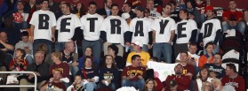 Cleveland Cavaliers fans in Ohio wear shirts expressing their disappointment towards LeBron James, who was with the Cavaliers for seven years before leaving to play for the Miami Heat