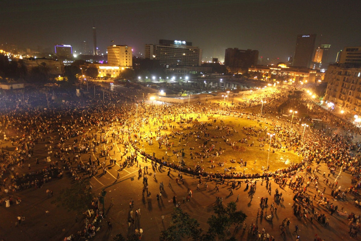 People gather in Tahrir square to celebrate the anniversary of an attack on Israeli forces during the 1973 war, in Cairo