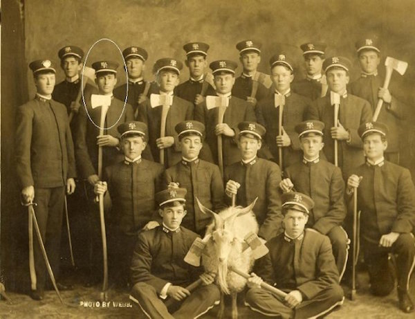 A group photo of Woodmen of the World with their goat mascot